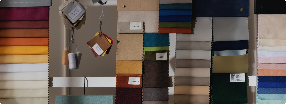 Fabric swatches and materials certified for fire safety compliance with FlameOFF FR Clear