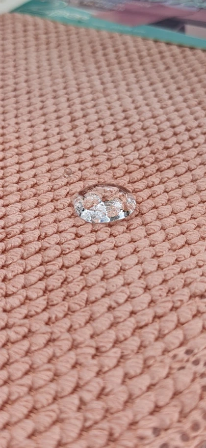 Water droplet on treated fabric surface illustrating fire retardant and protective coating