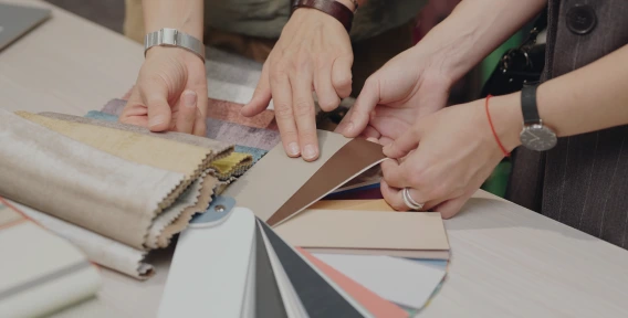 Designers selecting fabric and color swatches for California fire safety compliance certification